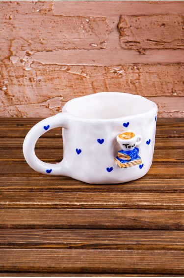 كوب كتابي وقهوتي